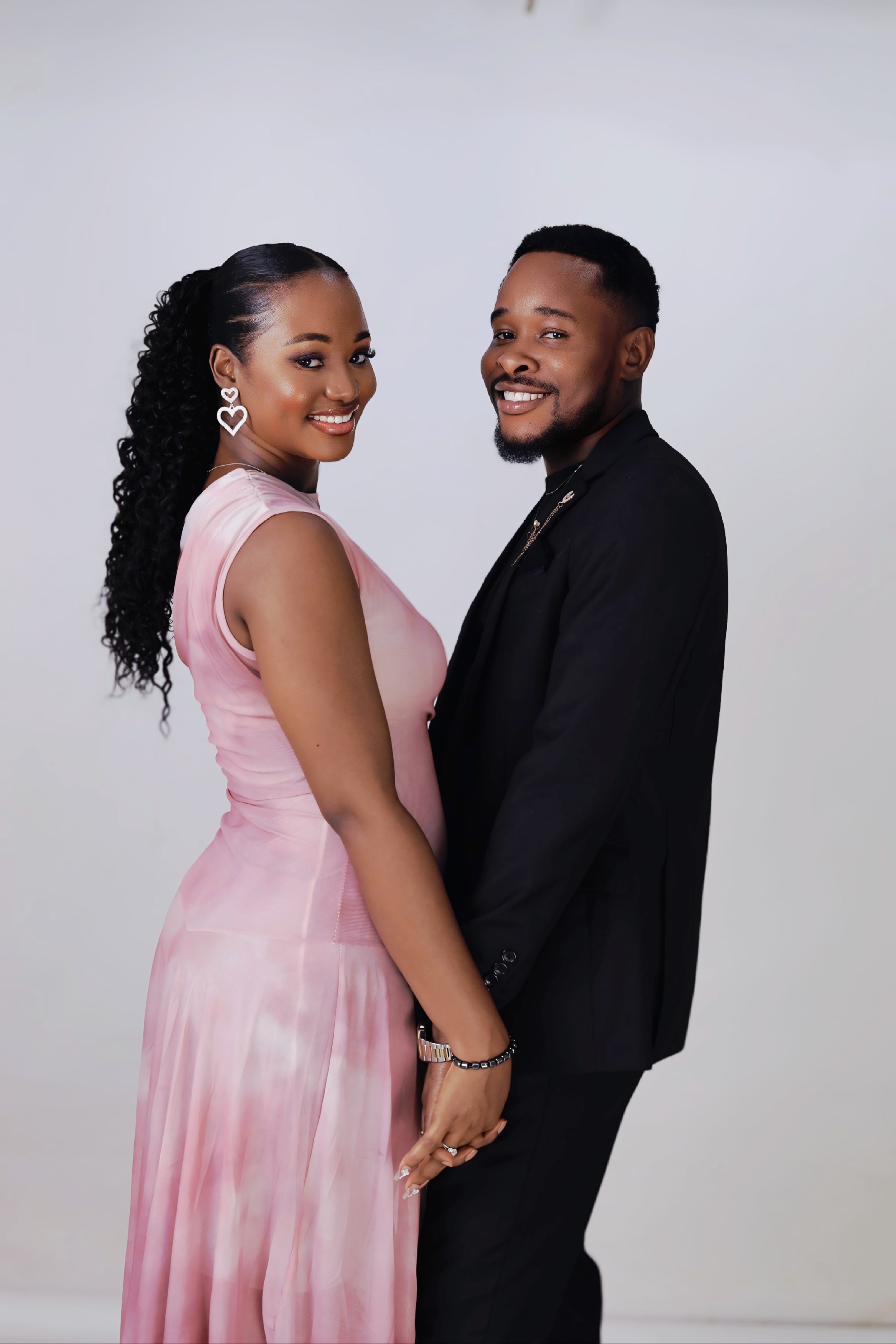 A smiling portrait of YUTIE and KM
